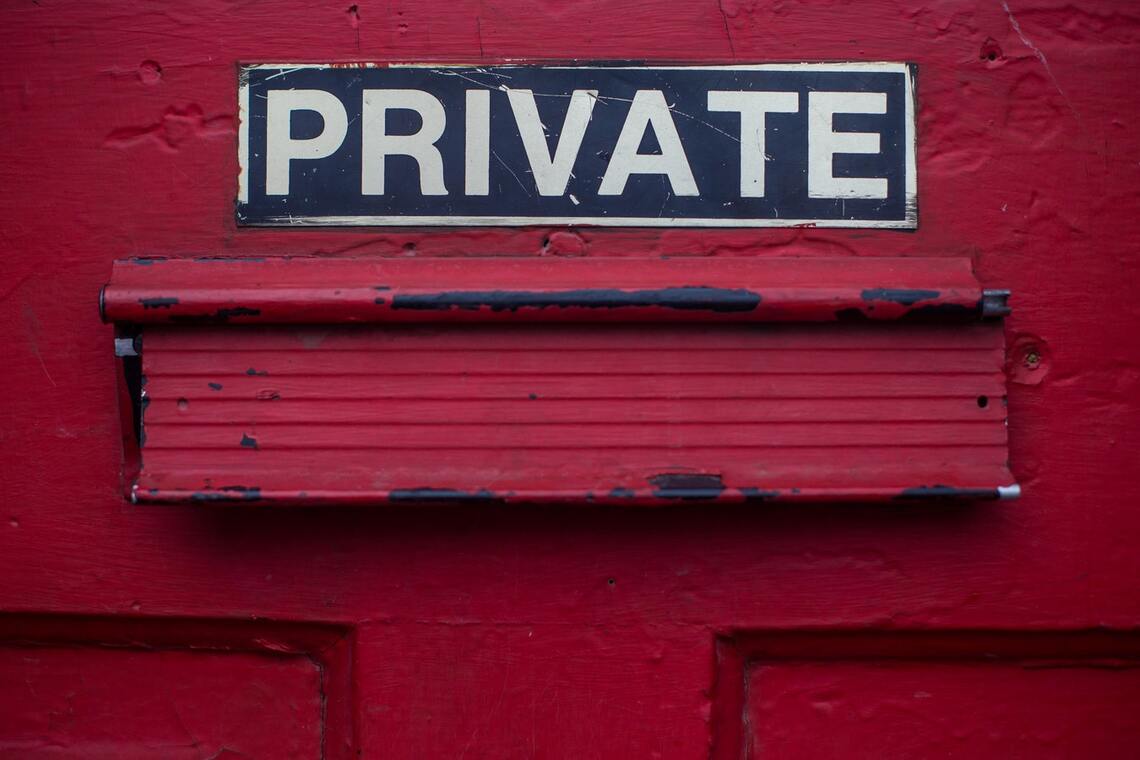 Closeup of red letterbox marked private