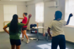 Issy leading a dance session with Afghan young people