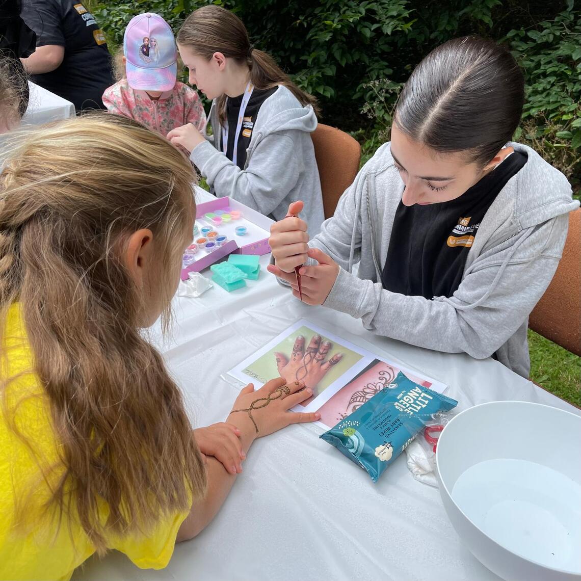 Young Commissioners Refugee Picnic henna tattoos