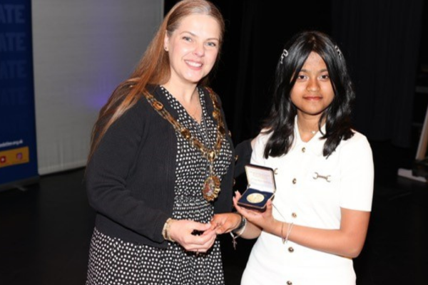 Young Commissioner Atrika receiving Jack Petchey Award from Councillor Louise Ferguson