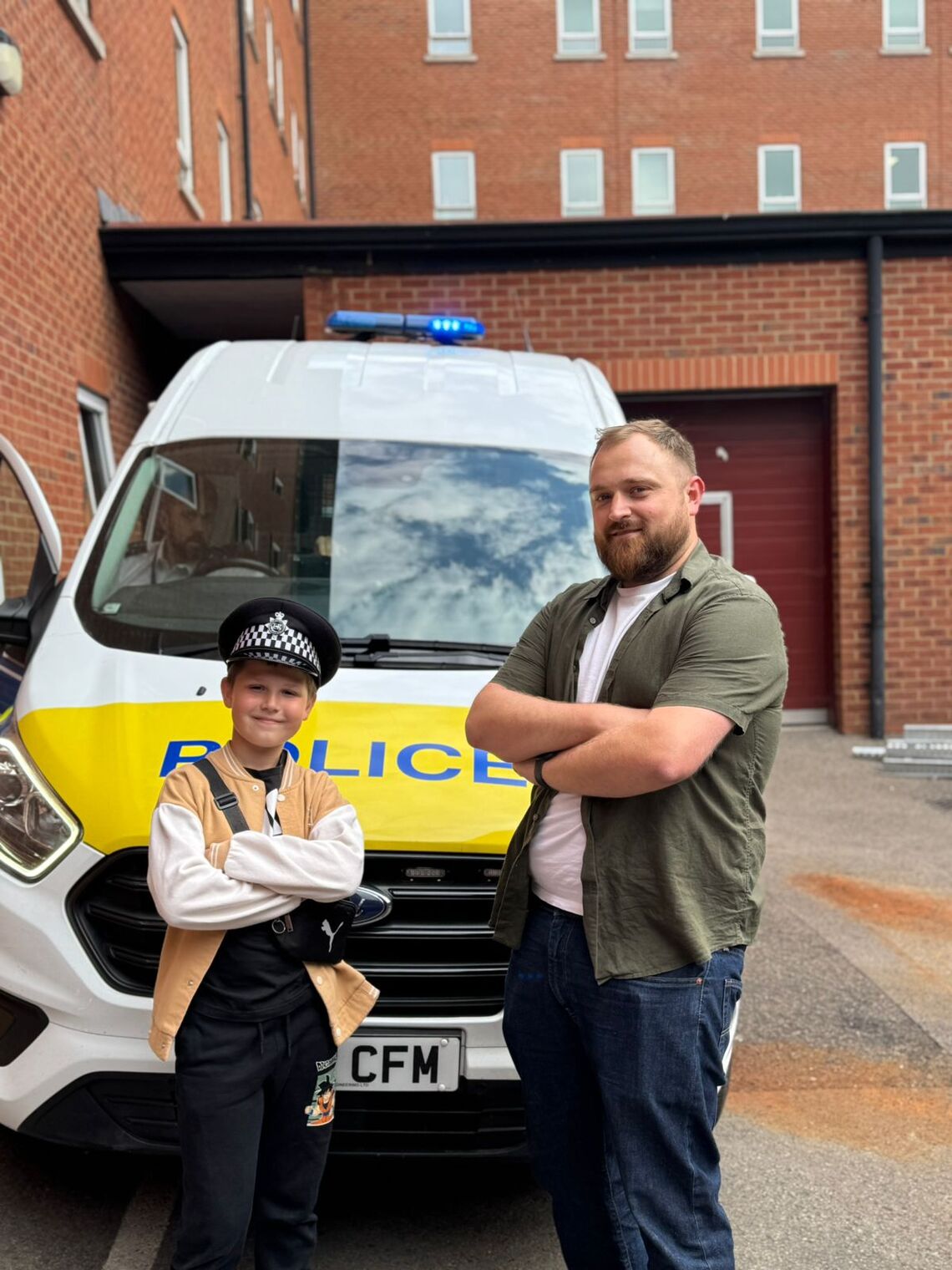 Ukranian boy visits Police Station with mentor