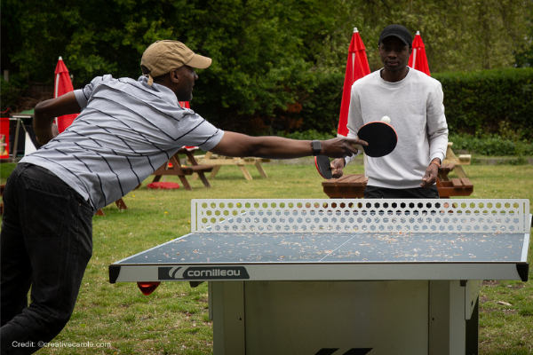Michael and Darren MAPS mentoring playing table tennis in the park