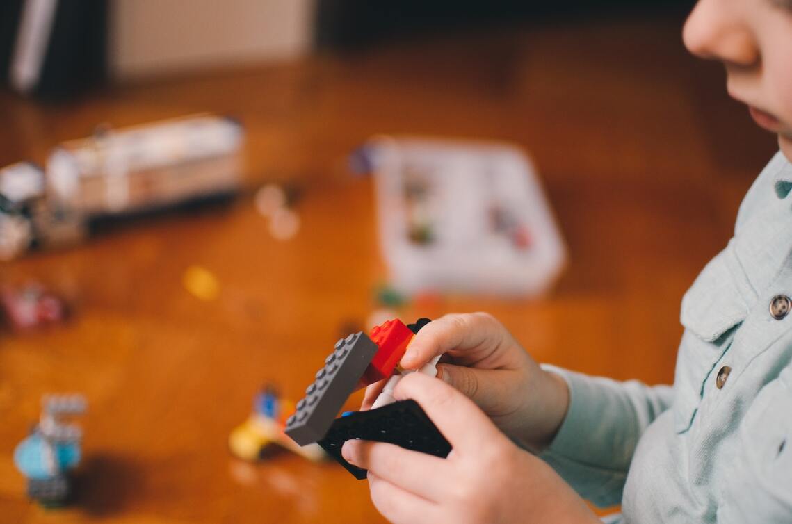 Child playing with lego