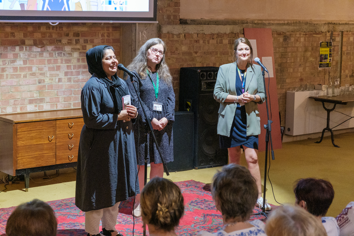 Female Speaker at Refugee Week Event