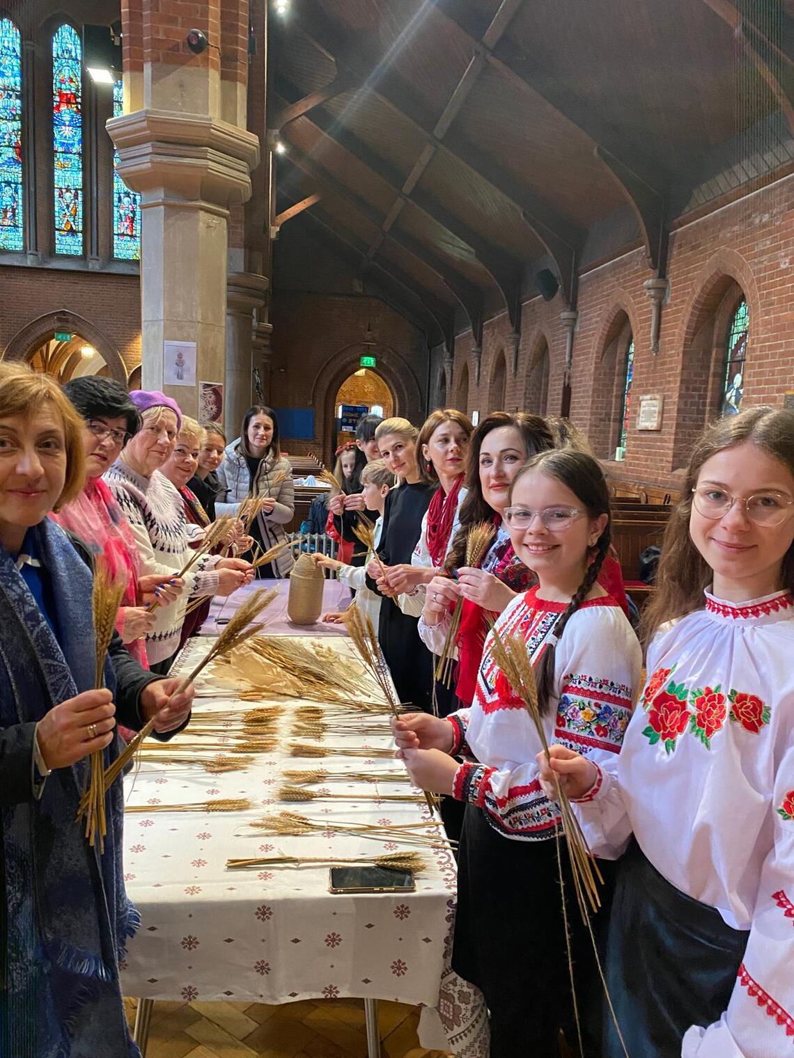 Ukraine weaving Didukh from wheat Christmas tradition