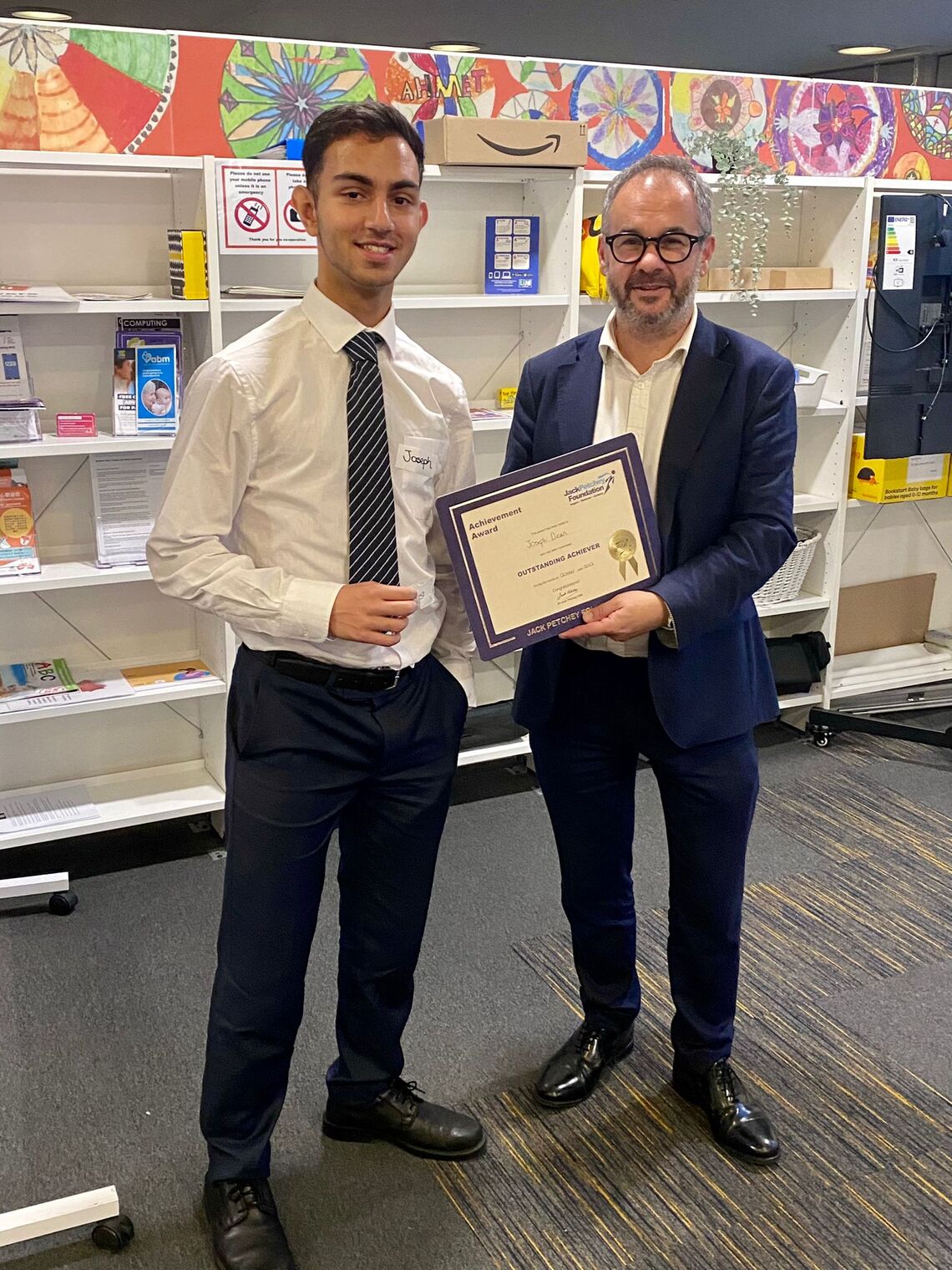 Young Commissioner Joseph receiving his Jack Petchey award from Paul Scully MP